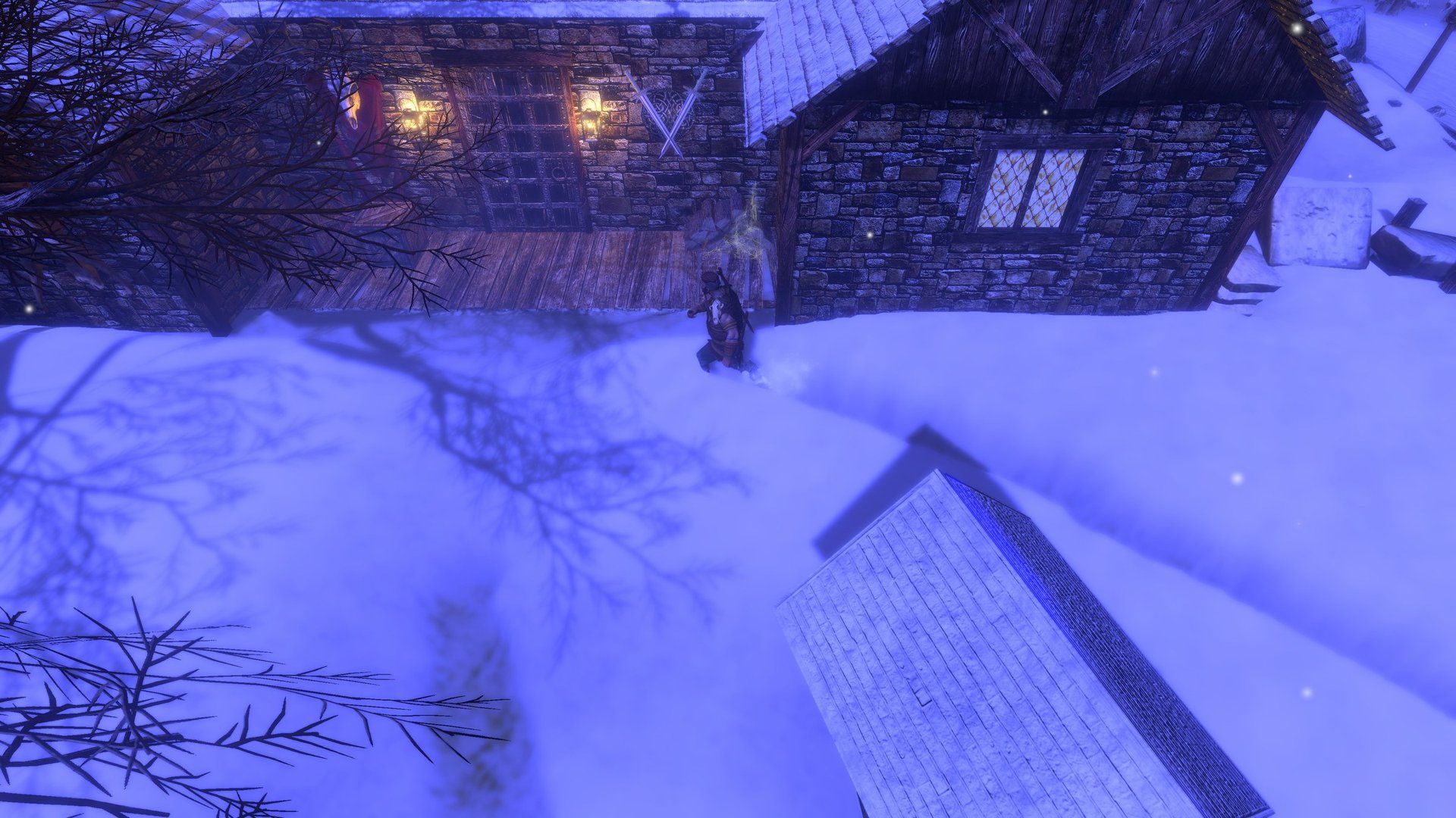 A snow-covered village with timber cottages under falling snow