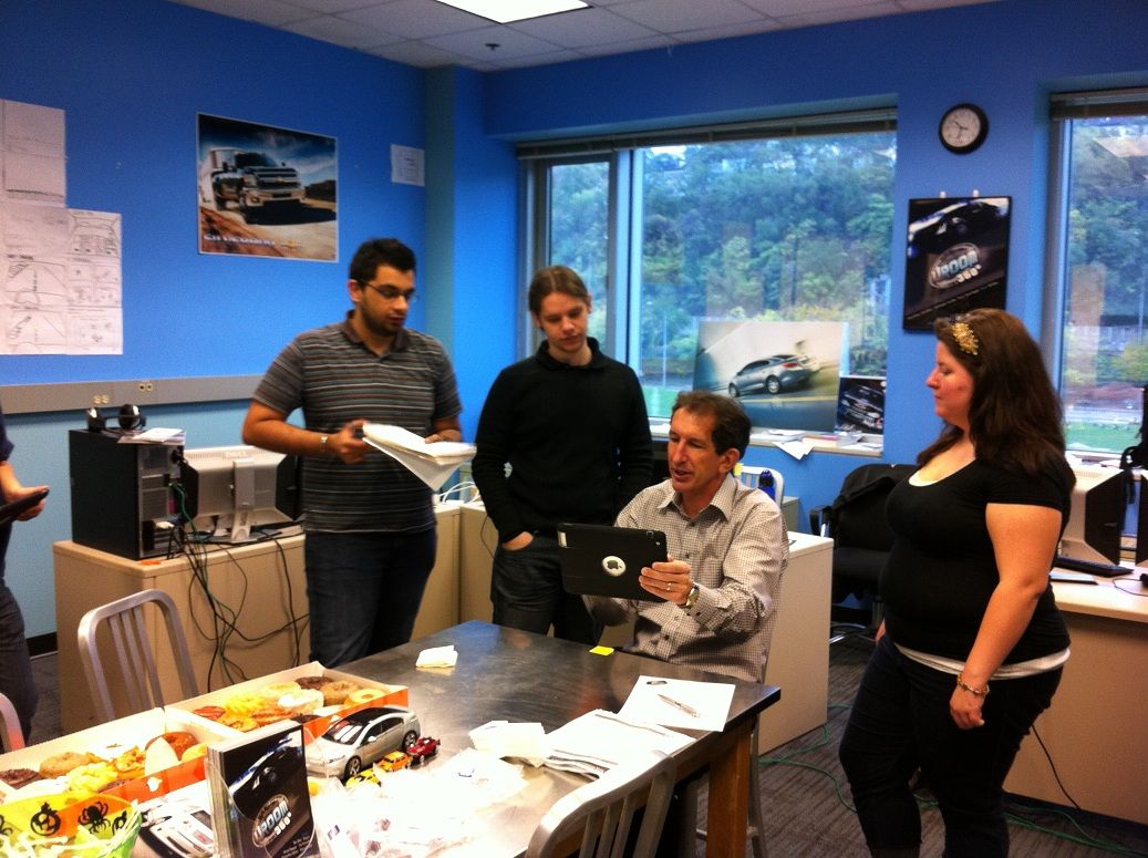The team demoing the app to a reviewer